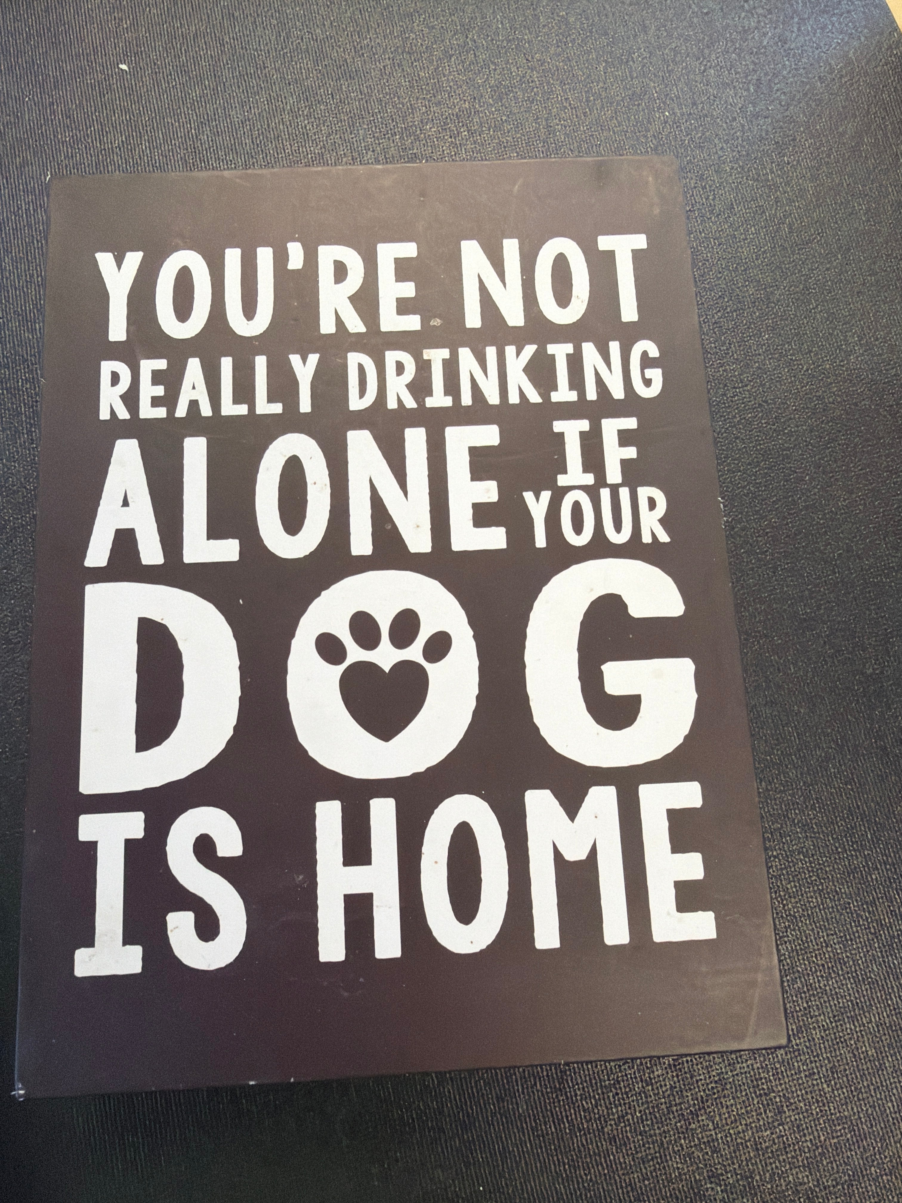 Dog drinking sign