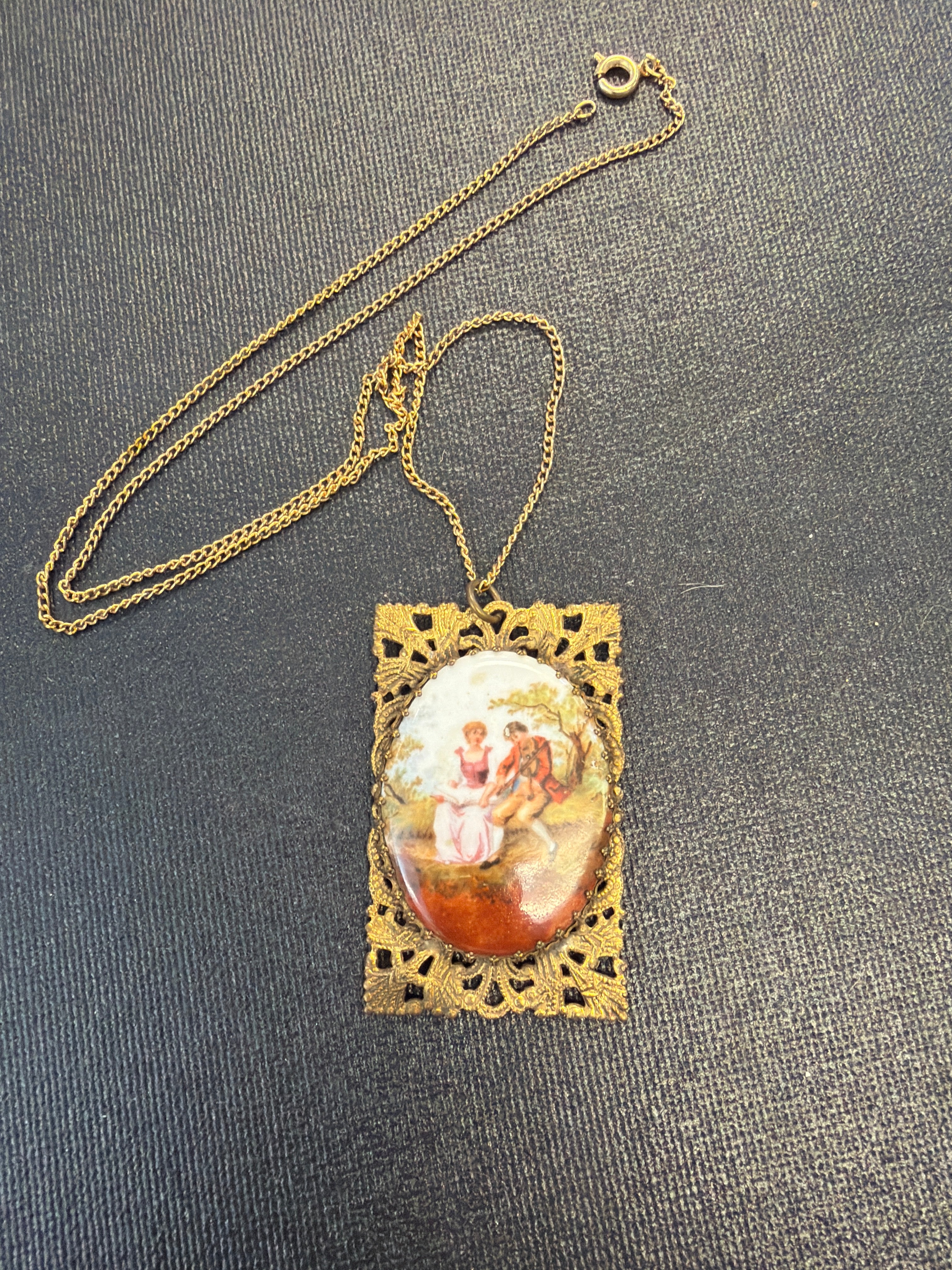 Gold tone porcelain pendant