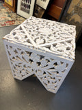 Antique white, intricately carved wood accent table