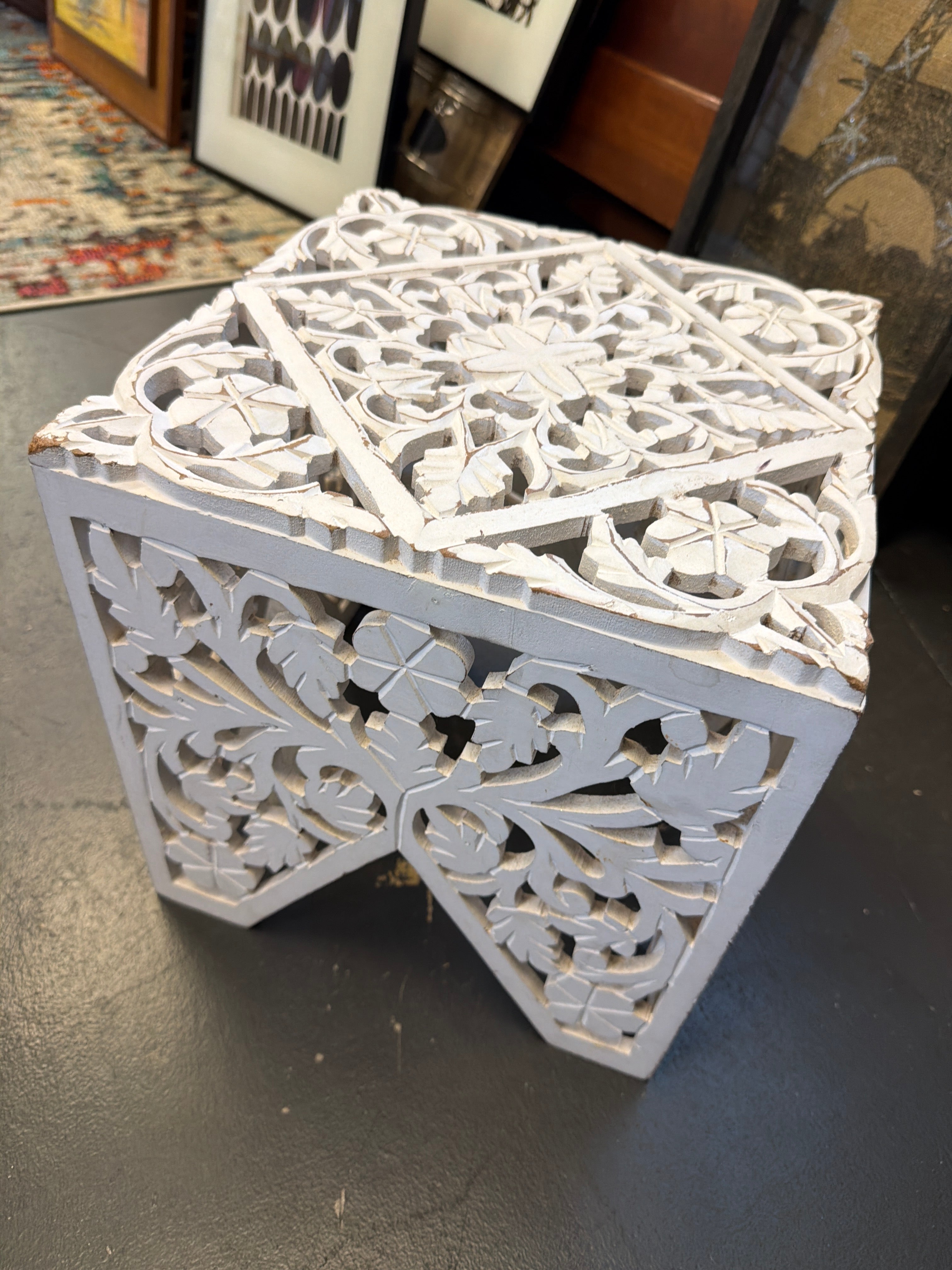 Antique white, intricately carved wood accent table