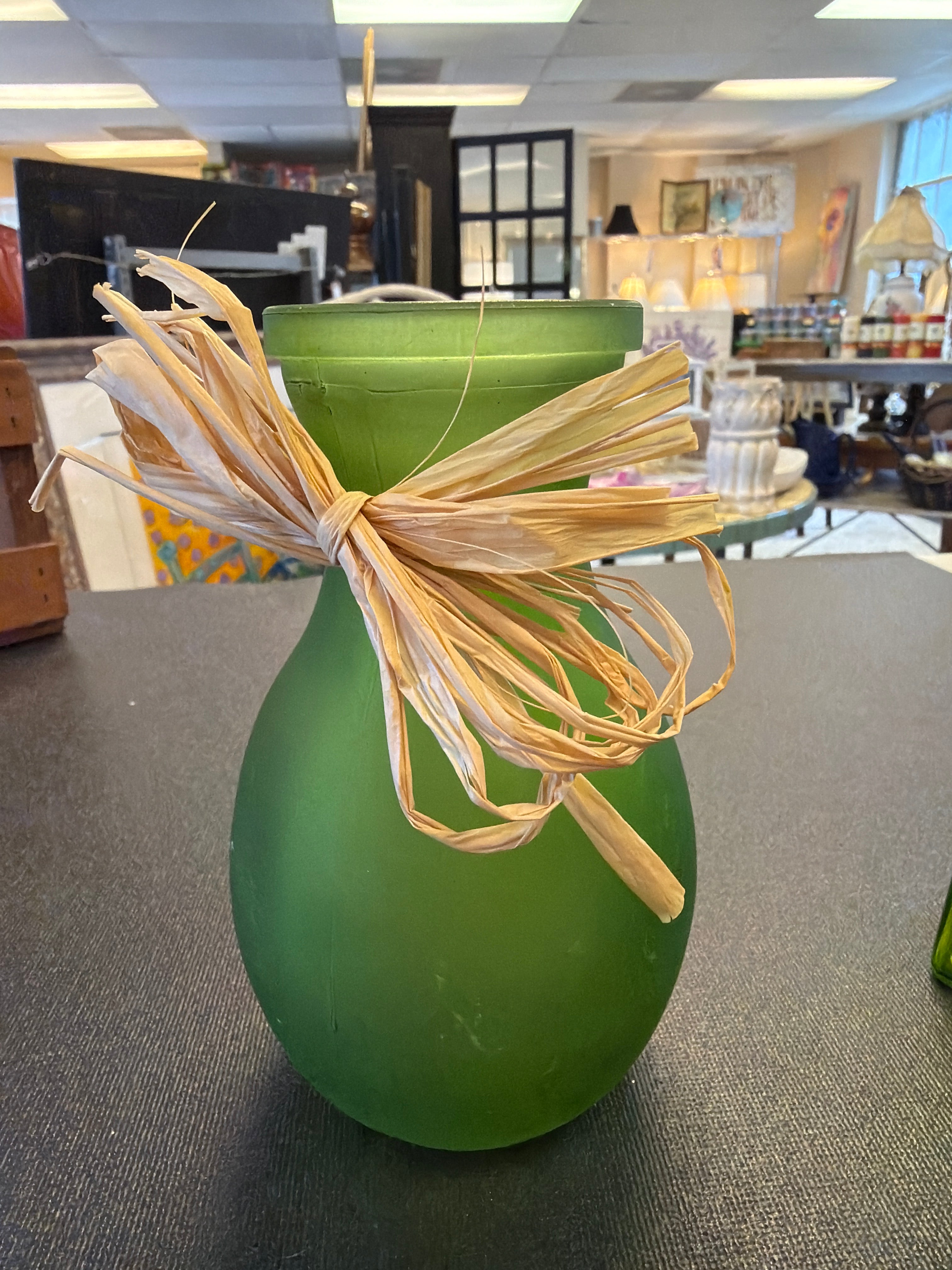 Green raffia bud vase