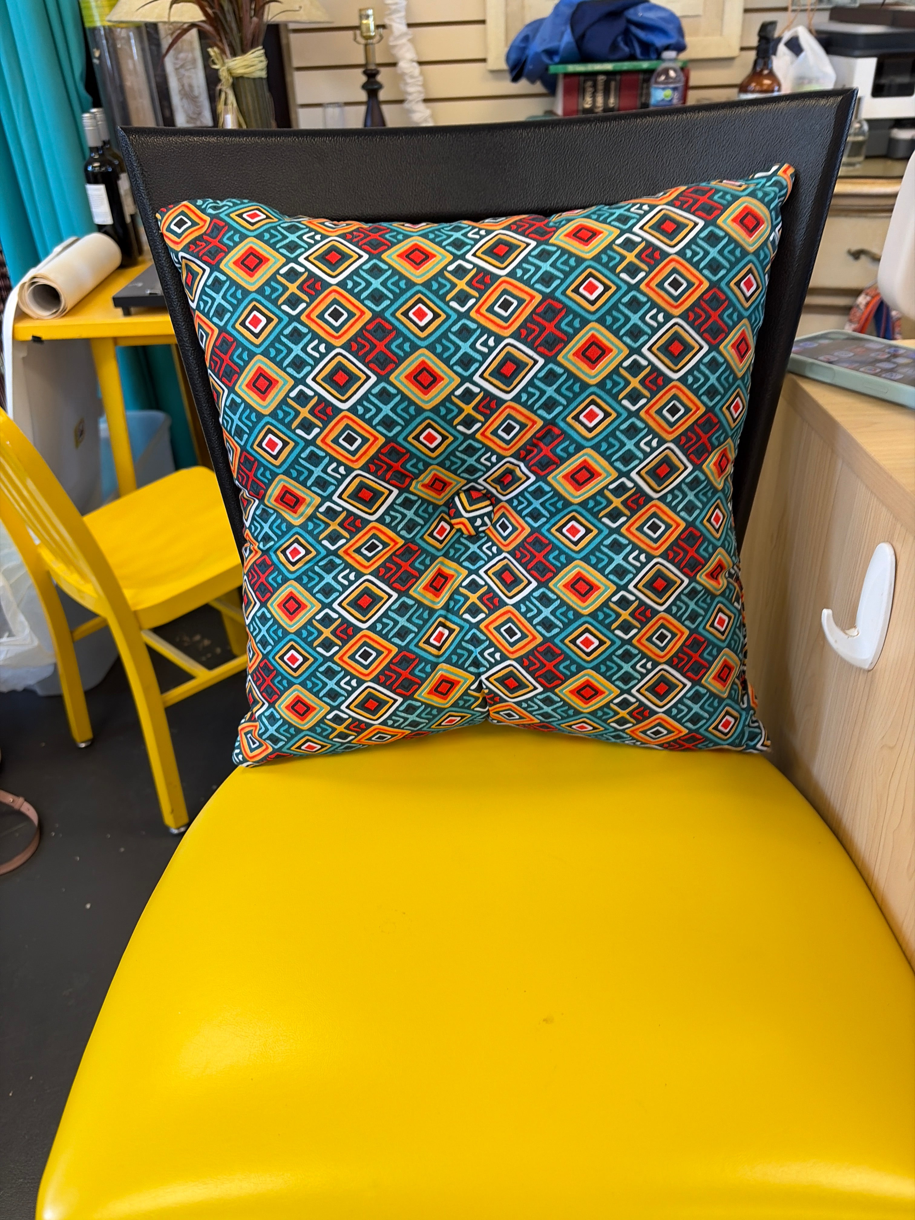 Lush Decor Boho Stripe reversible decorative pillow featuring a turquoise and tangerine geometric pattern.