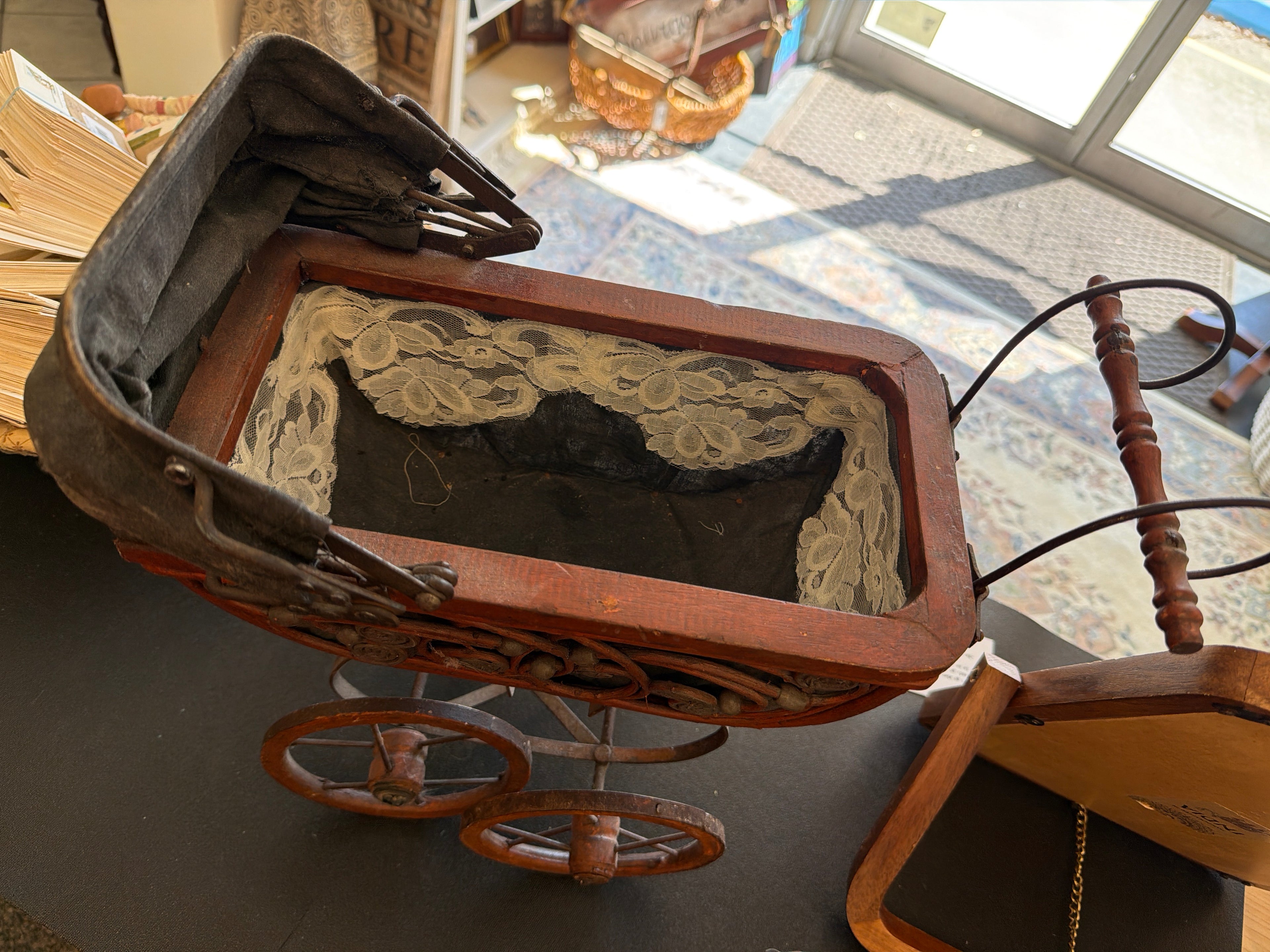 Antique Victorian-style doll pram.