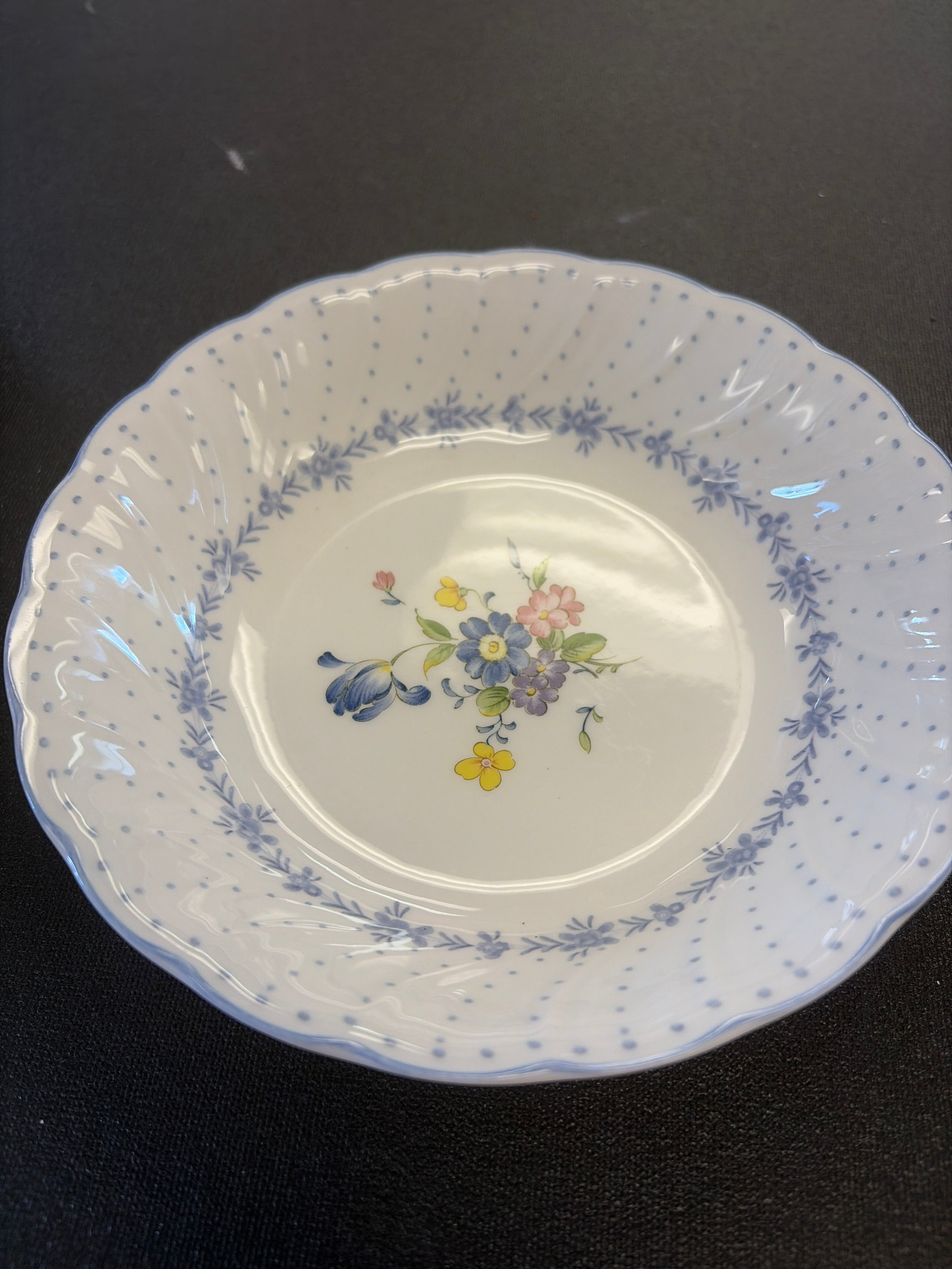 Blue Peony Bowl, featuring a central floral bouquet and scalloped edges