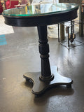 Round pedestal table with glass
