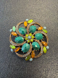 Green floral brooch