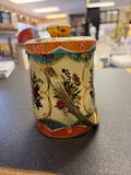 Vintage Murray-Allen Regal Crown confection tin featuring floral designs and a metallic handle