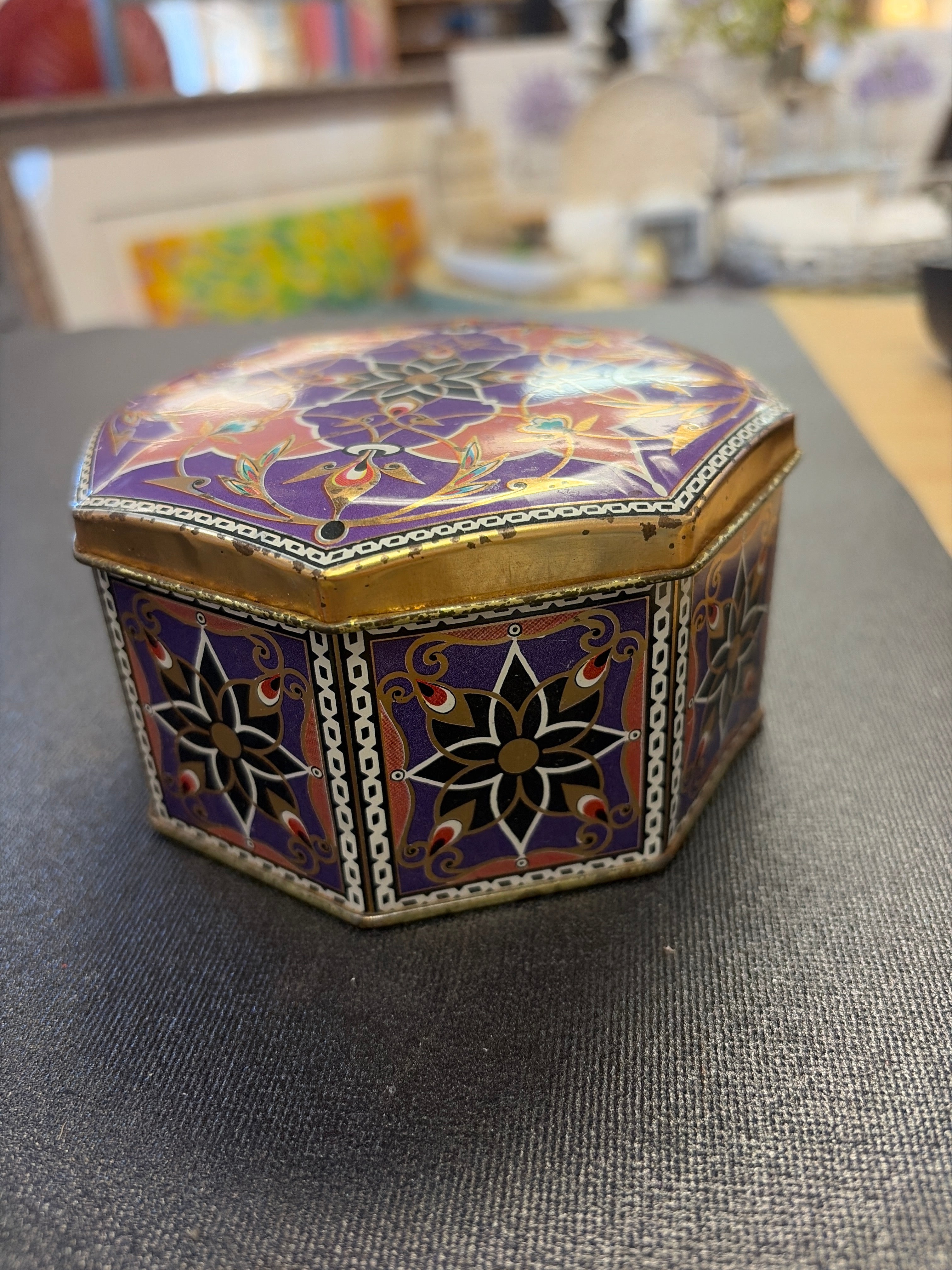 Vintage collectible Meister lidded tin made in Brazil featuring a purple and gold geometric or floral design