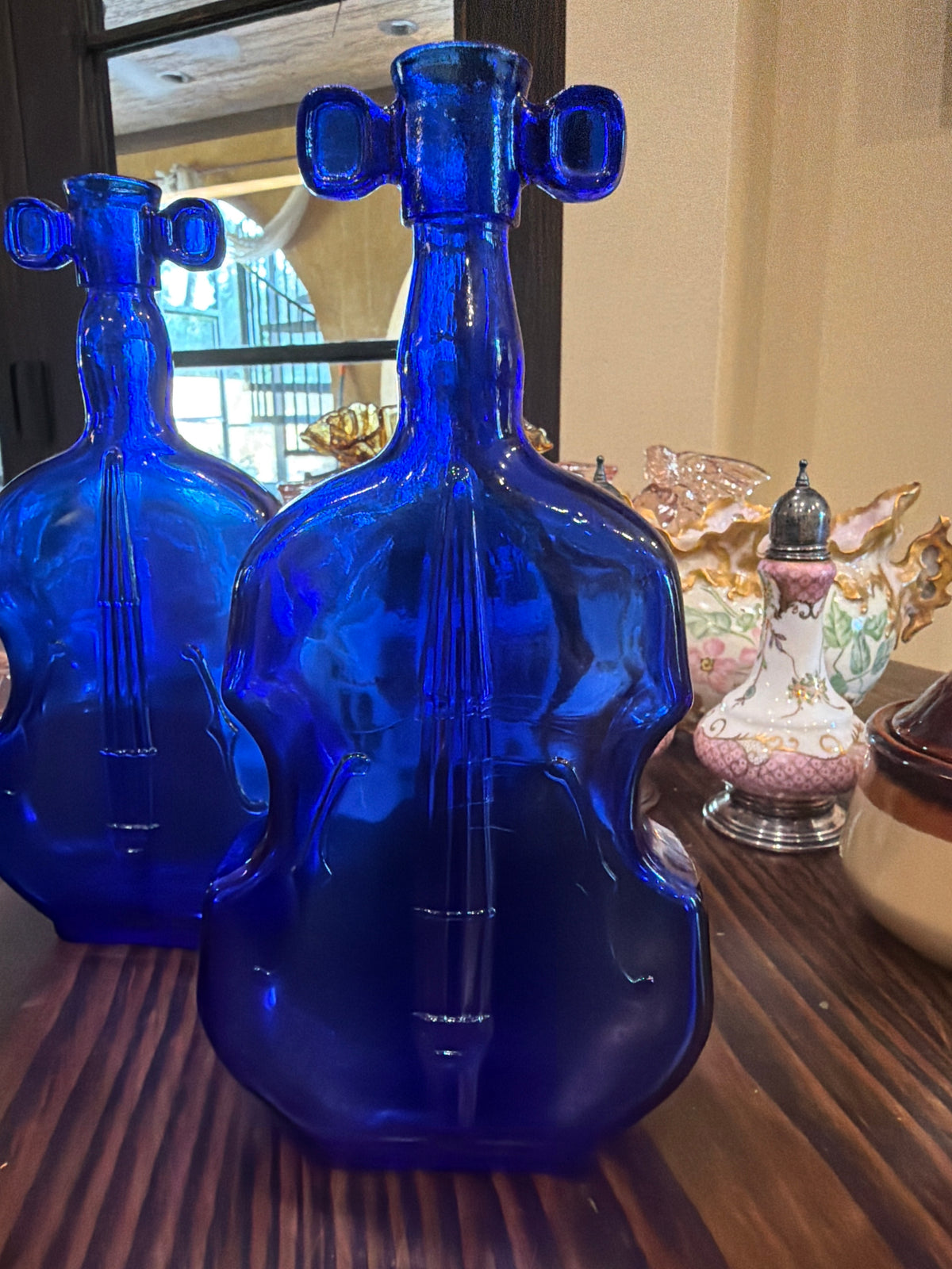 Vintage cobalt blue glass violin-shaped bottle