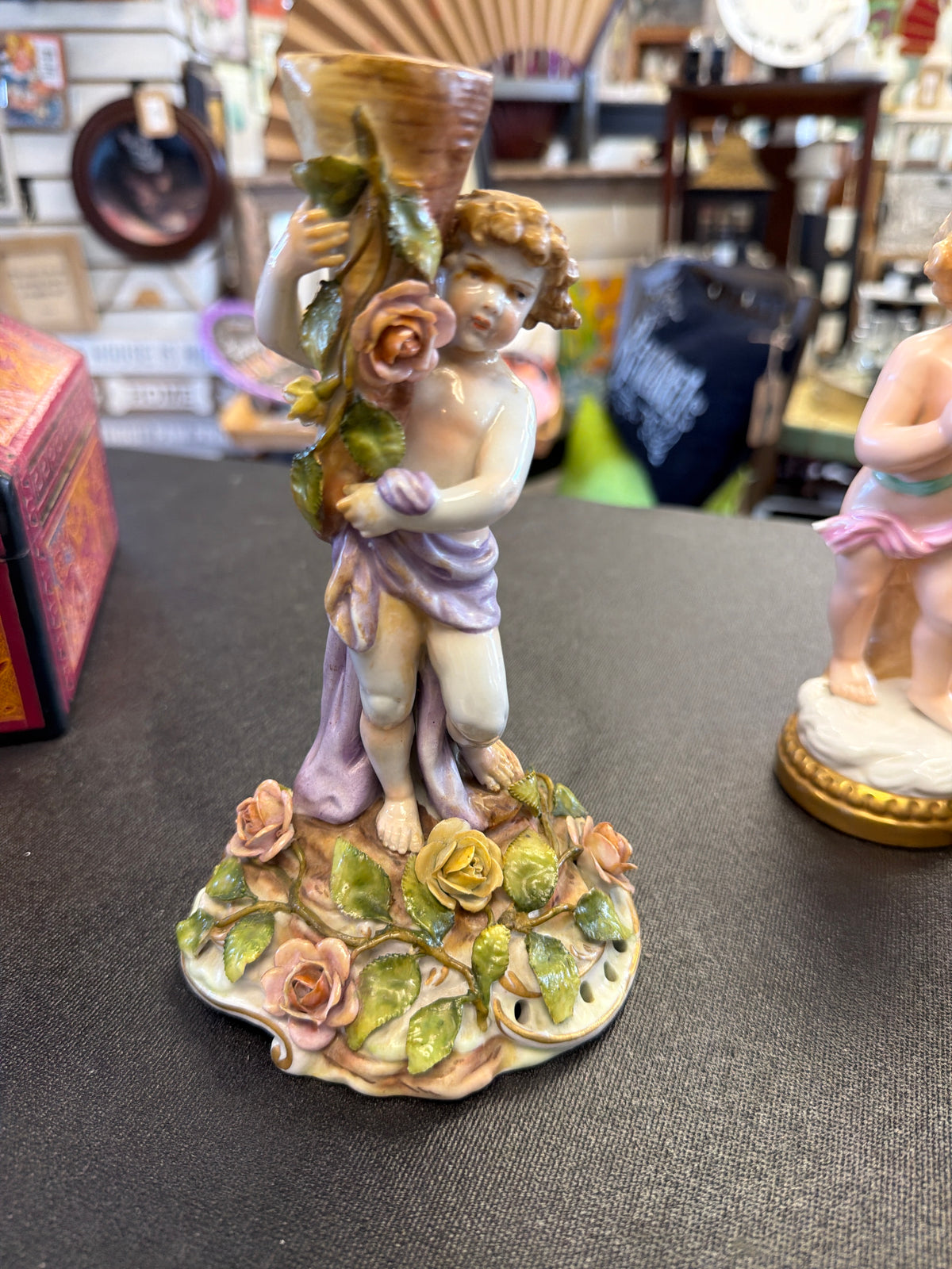 German hand-painted porcelain cherub (putto) candlestick
